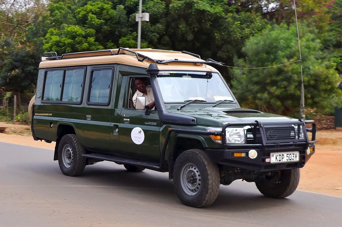 A 4x4 land cruiser with pop-up roof ready for safari